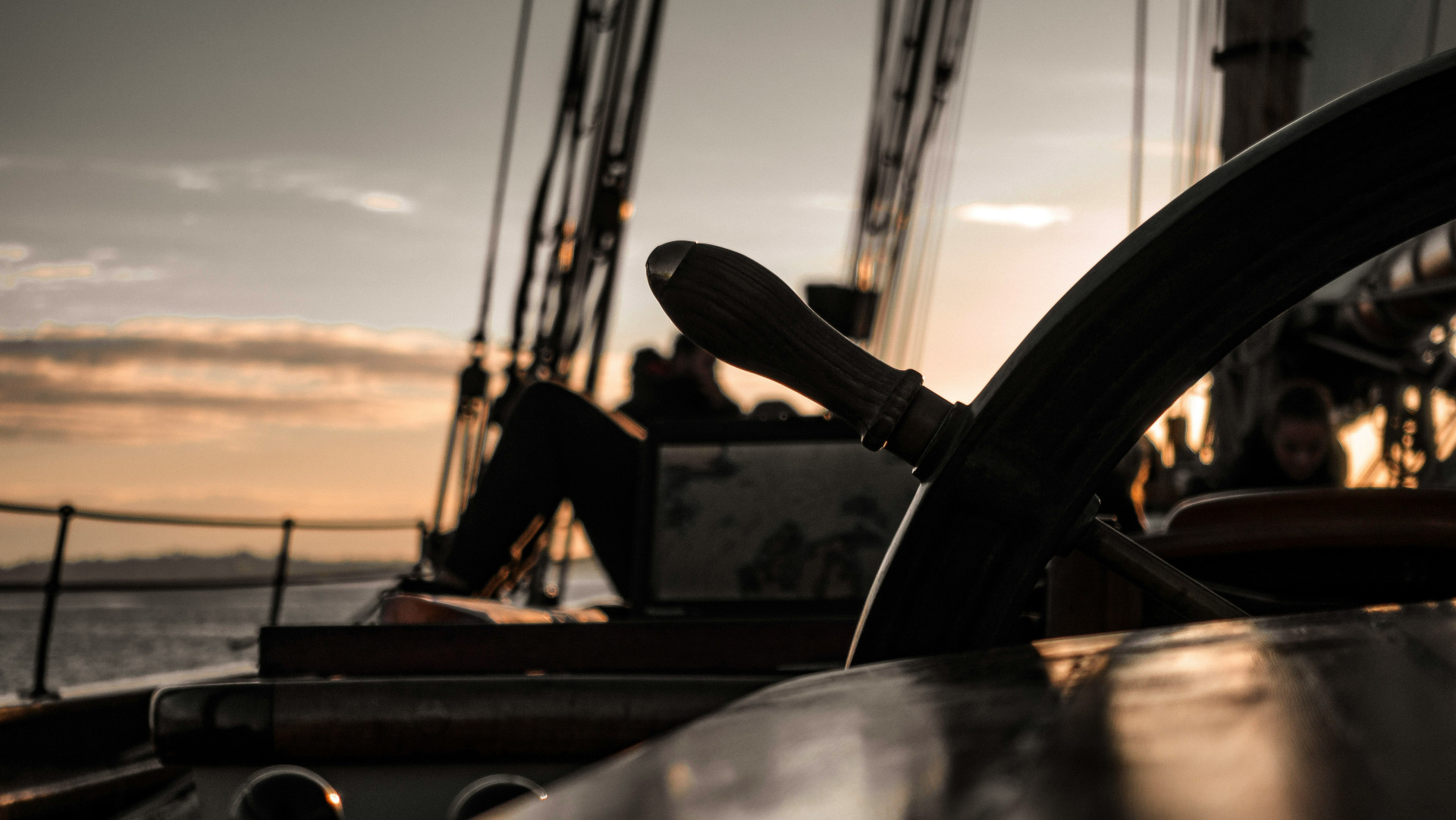 Sailing ship wheel at dusk