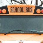 Close up of school bus windshield and sign from the front