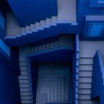 Looking down at a blue, maze-like set of staircases