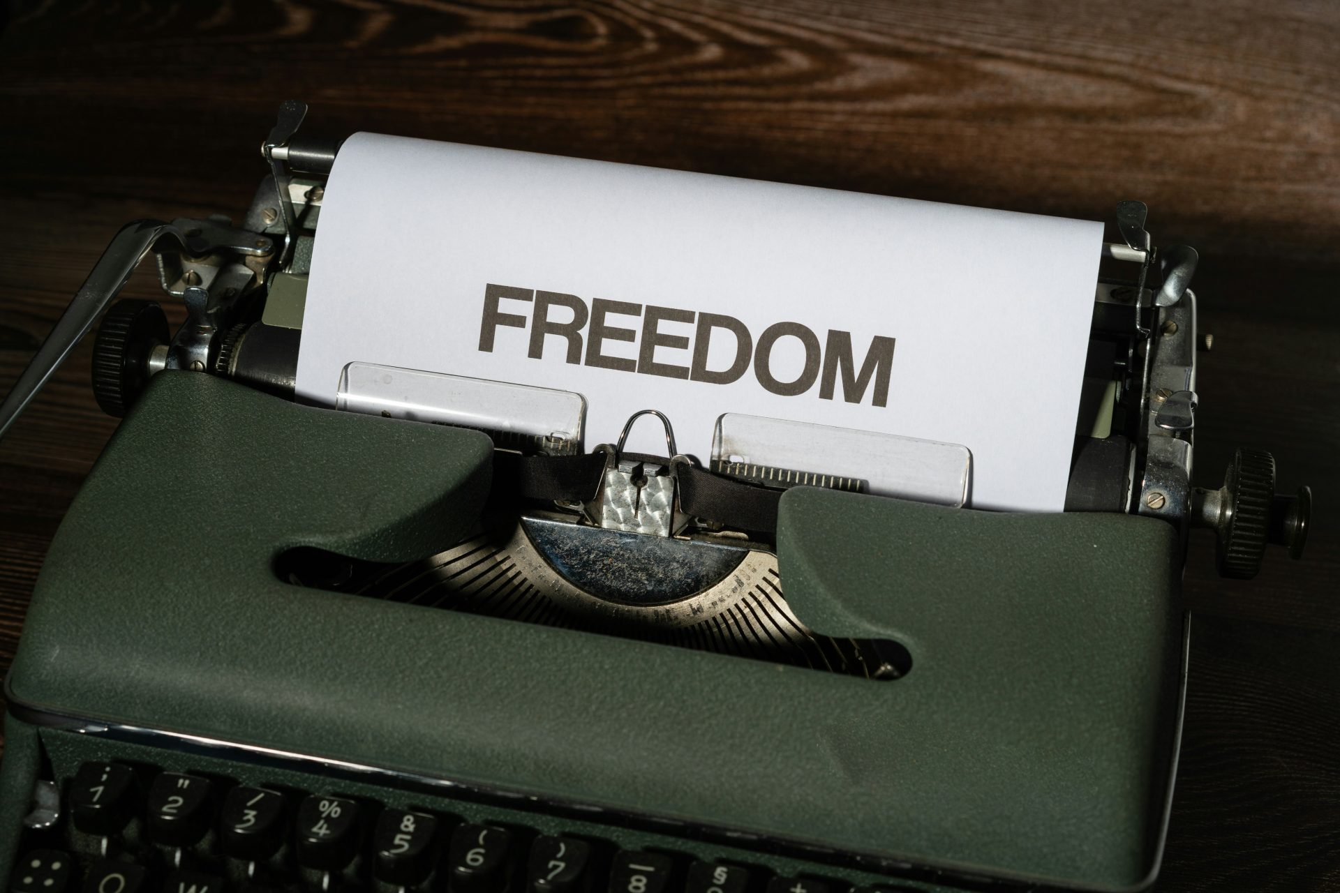 Typewriter with FREEDOM written in large type.
